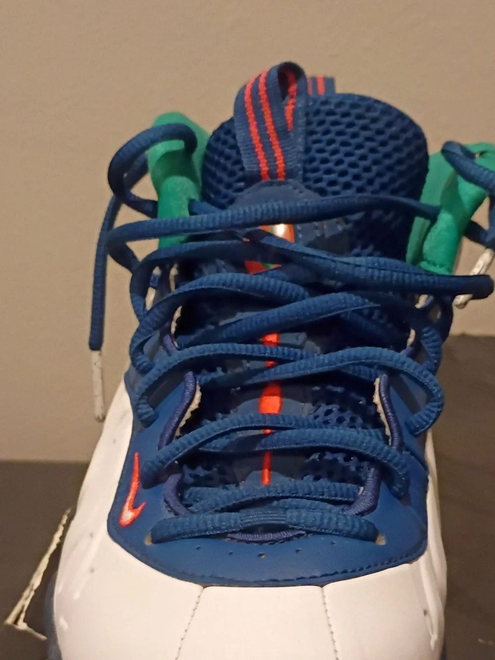 Nike Kids White and Blue Sneakers with Green and Orange Accents